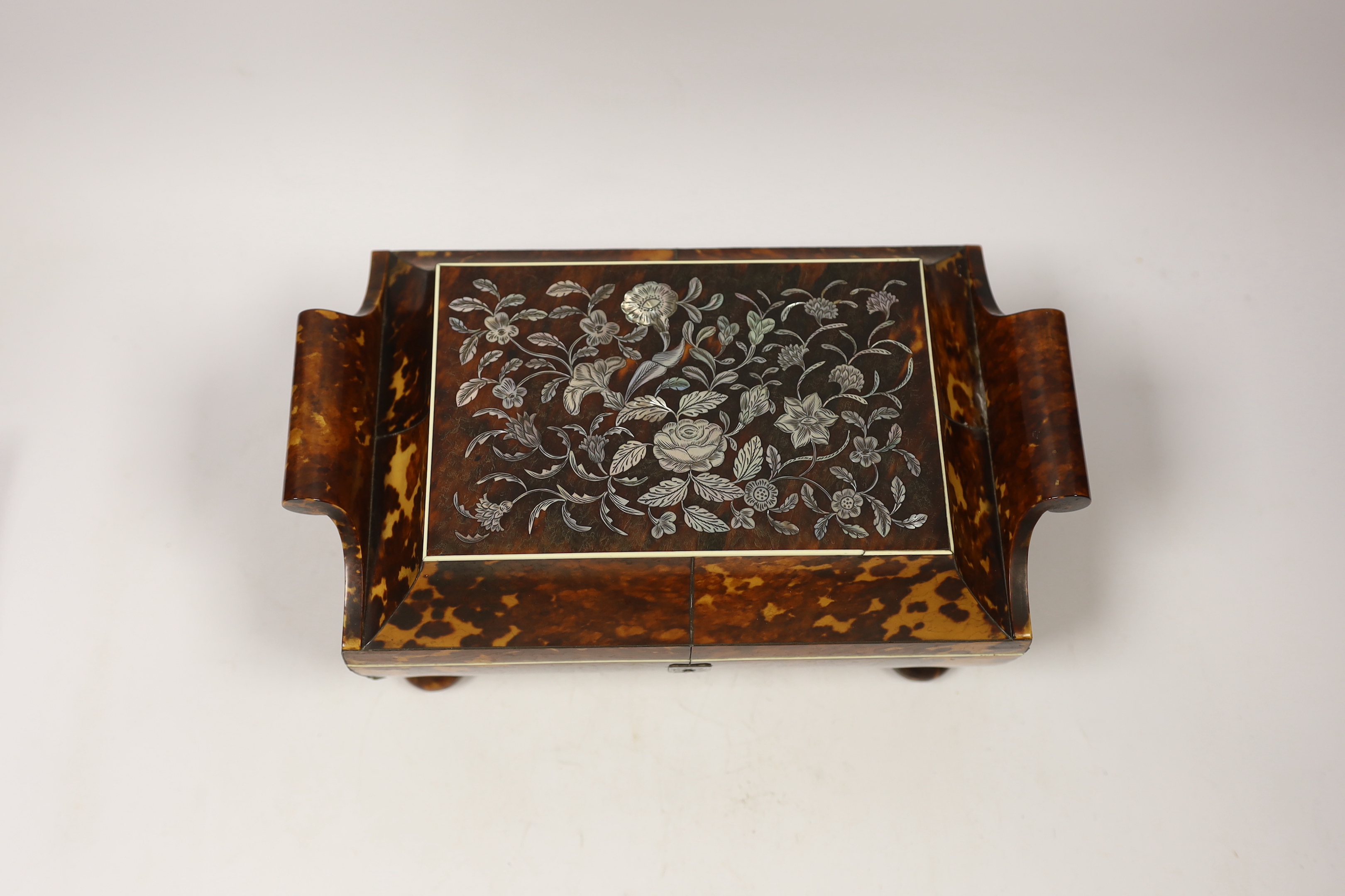 An early 19th century tortoiseshell and mother of pearl inlaid work box with ivory banding, 24cm wide, 16cm deep, 12cm high CITES Submission reference, EWCE2JLY